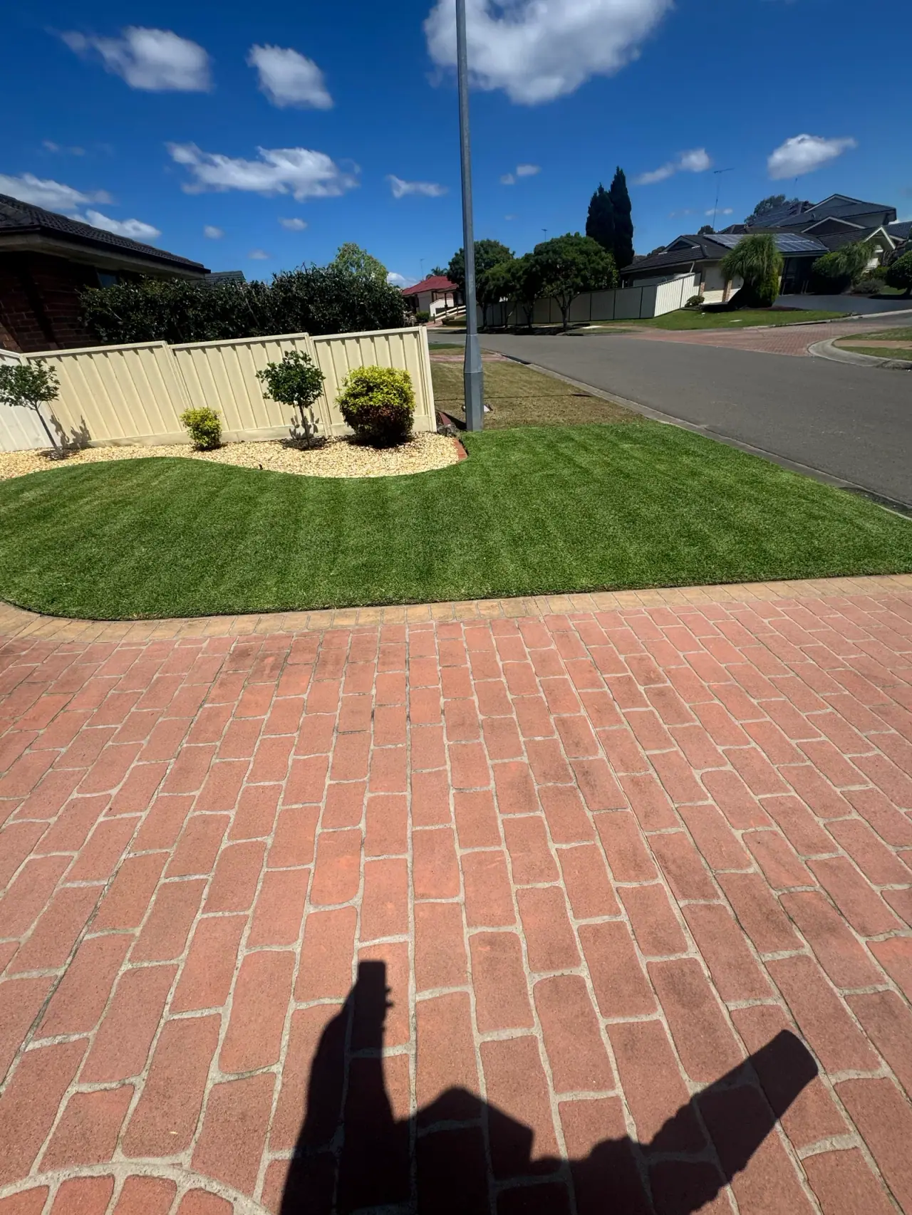 Freshly mown front lawn with defined garden edges